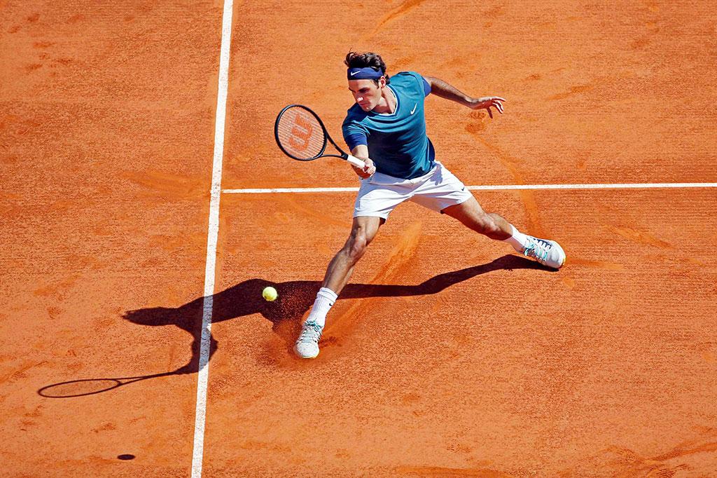 Federer Melaju ke Babak Delapan Besar