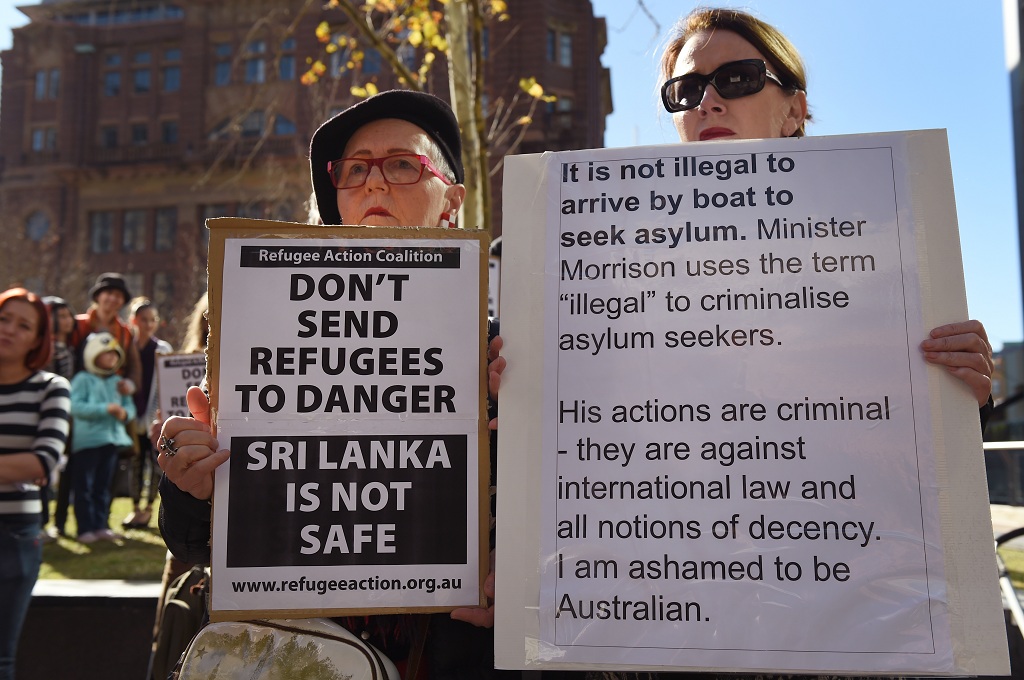 Warga Australia di Sydney memprotes kebijakan pemerintah yang memulangkan puluhan pencari suaka asal Sri Lanka -- WILLIAM WEST / AFP