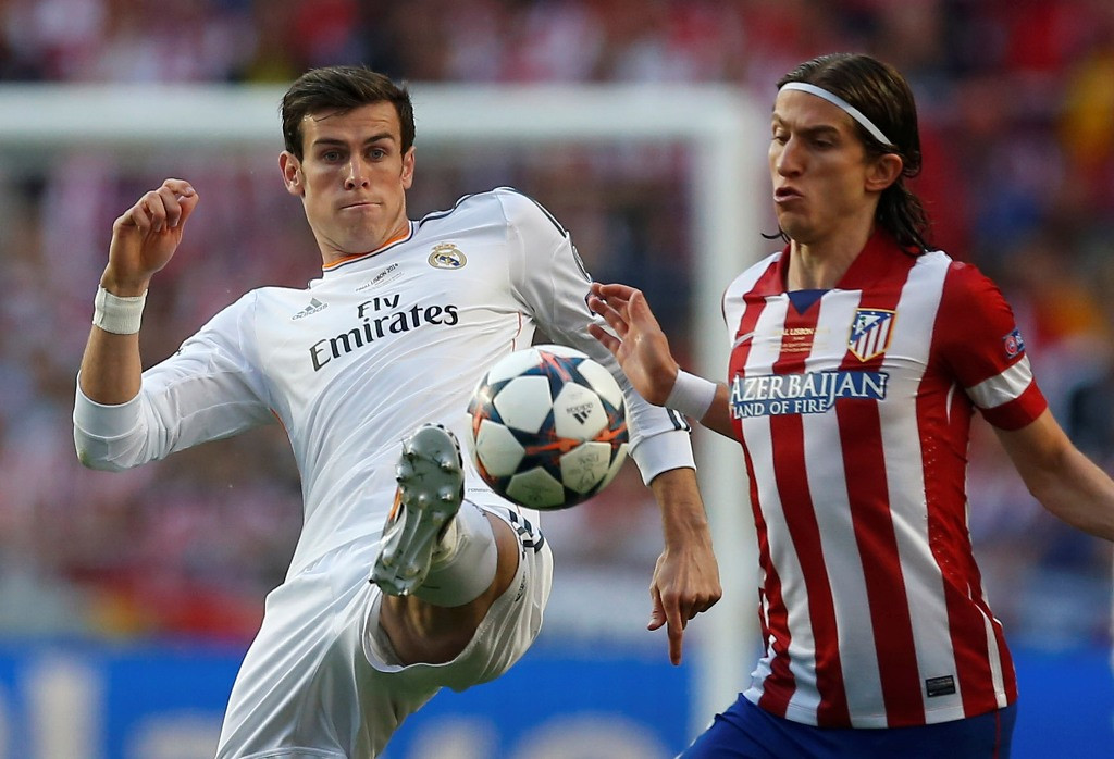 Filipe Luis (Kanan). (Foto: Andres Kudacki/AP)