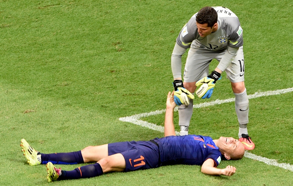 Julio Cesar (abu-abu) saat tampil di Piala Dunia 2014.(foto:AFP/Evaristo SA)