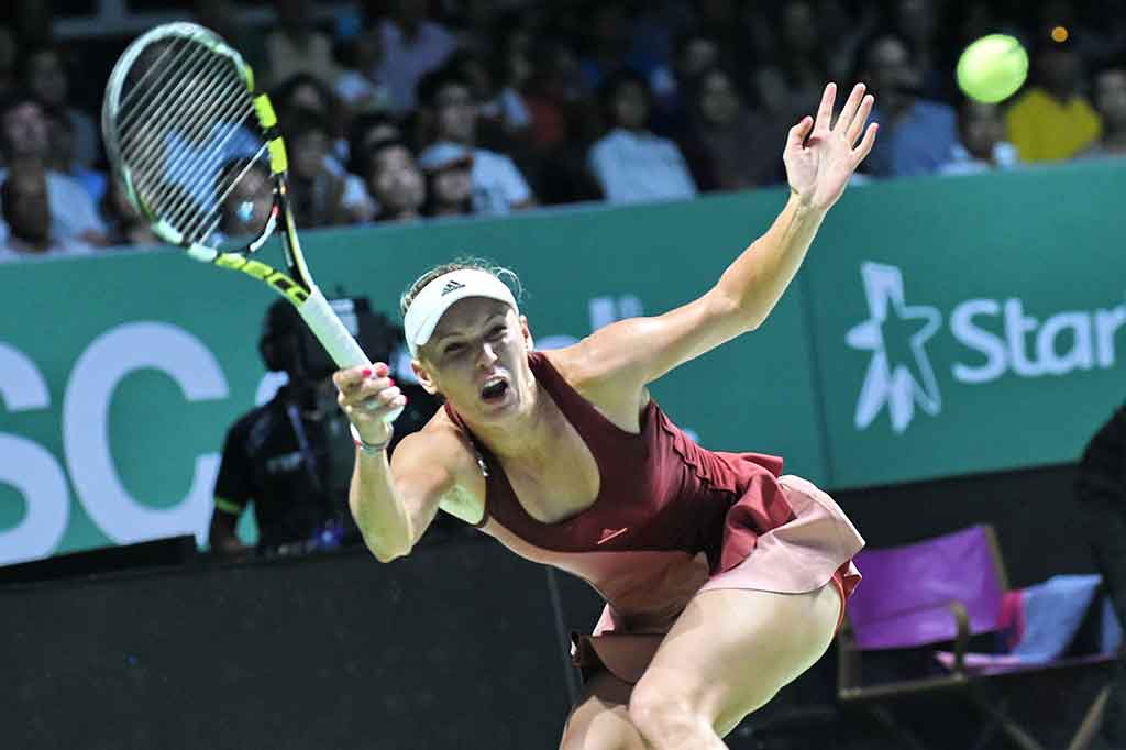 Wozniacki Kalahkan Radwanska di WTA Finals Singapura