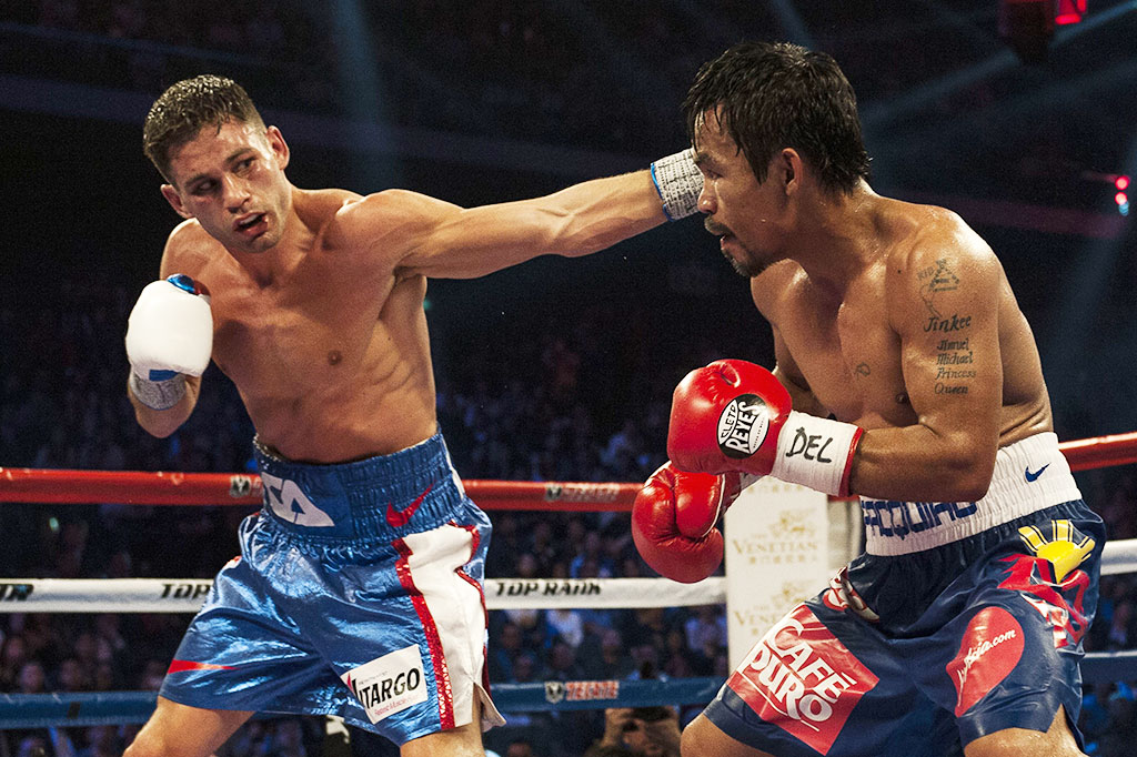 Pacquiao Pertahankan Sabuk Kelas Welter WBO