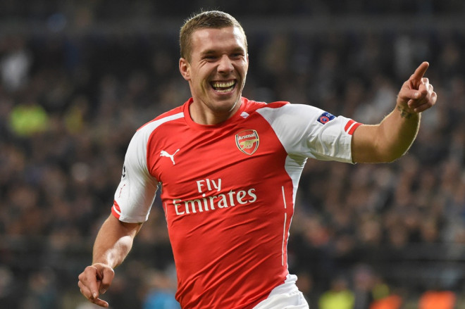Lukas Podolski saat merayakan gol untuk Arsenal (Foto: AP Photo/Geert Vanden Wijngaert)