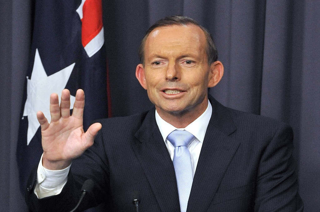 PM Australia Tony Abbott berbicara ke hadapan awak media di gedung parlemen di Canberra - AFP / MARK GRAHAM 