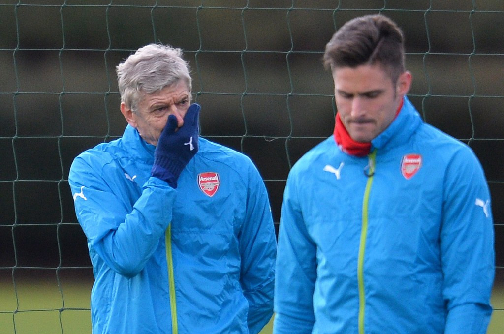 Kebersamaan pelatih Arsenal Arsene Wenger dengan salah satu pemainnya, Olivier Giroud. (AFP PHOTO / GLYN KIRK)