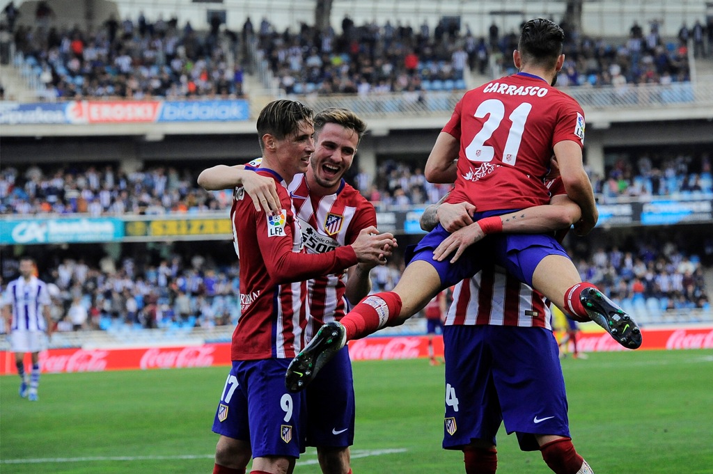 Para pemain Atletico Madrid merayakan gol Yannick Carrasco (Foto: AP/Alvaro Barrientos)