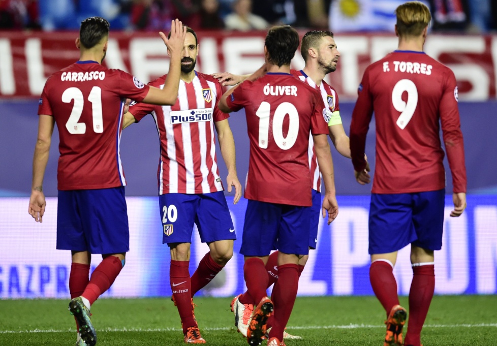 Pemain Atletico merayakan gol yang dicetak oleh Oliver Torres (Foto: AFP PHOTO/ JAVIER SORIANO)