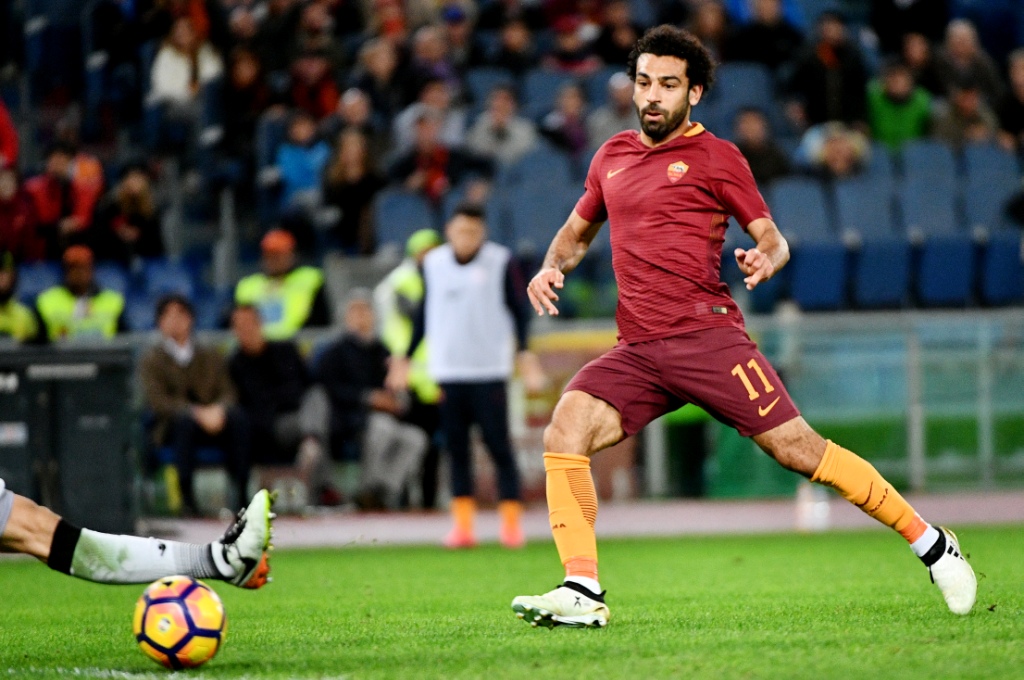 Mohamed Salah setelah mencetak gol kedua ke gawang Bologna (Foto: VINCENZO PINTO / AFP)