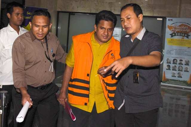 Rajamohanan Nair gunakan rompi oranye. Foto: Antara/ Hafidz Mubarak