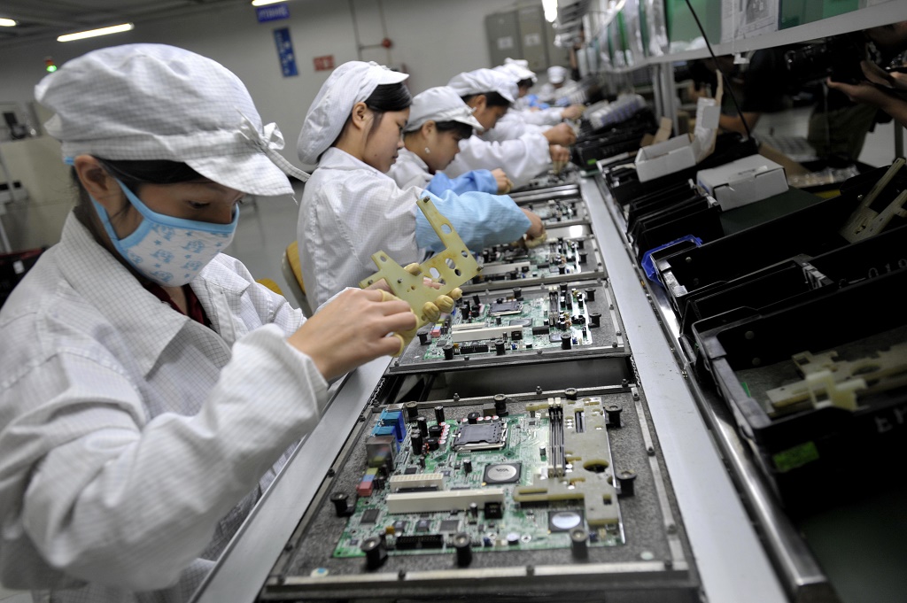 Ilustrasi proses perakitan di Foxconn. (AFP/ AFP Getty Images)