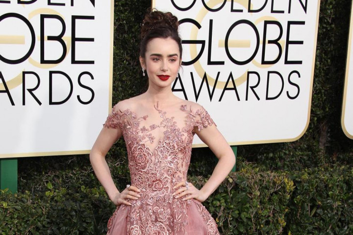 Lily Collins Maafkan Phil Collins karena Tak Jadi Ayah Sempurna