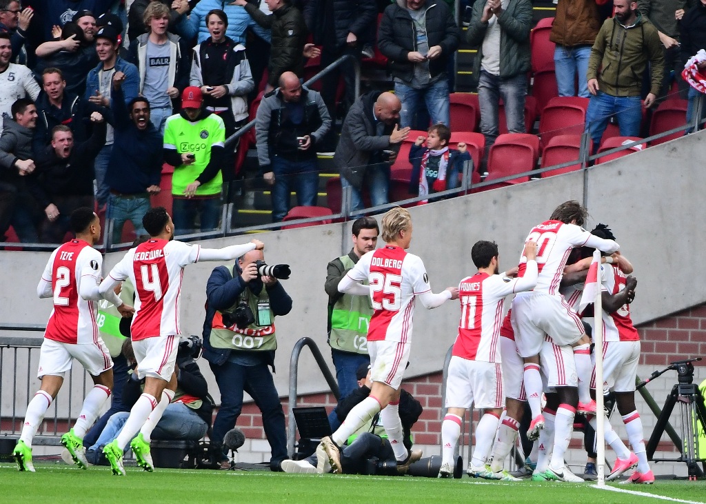 Pemain Ajax Amsterdam merayakan kemenangan atas Celta Vigo. (Foto: AFP/Emmanuel Dunand)