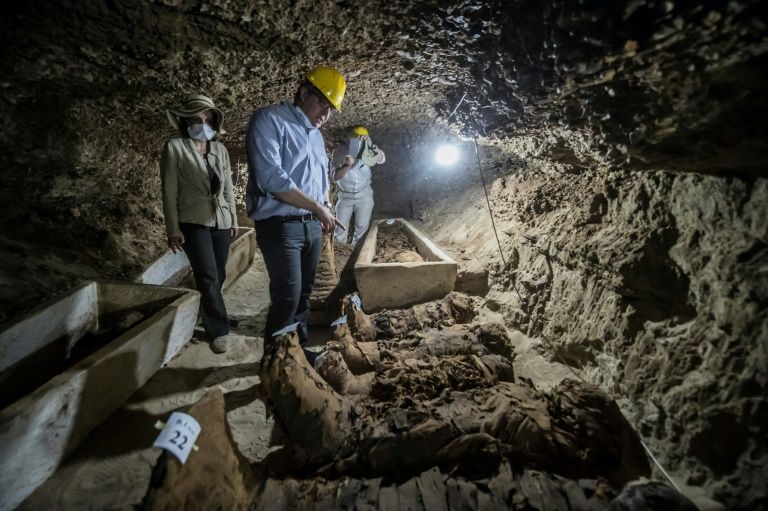 Egyptian Antiquities Minister Khaled el-Enany speaks to media on May 13, 2017, in front of mummies discovered in catacombs in Touna el-Gabal district, Minya province, in central Egypt.