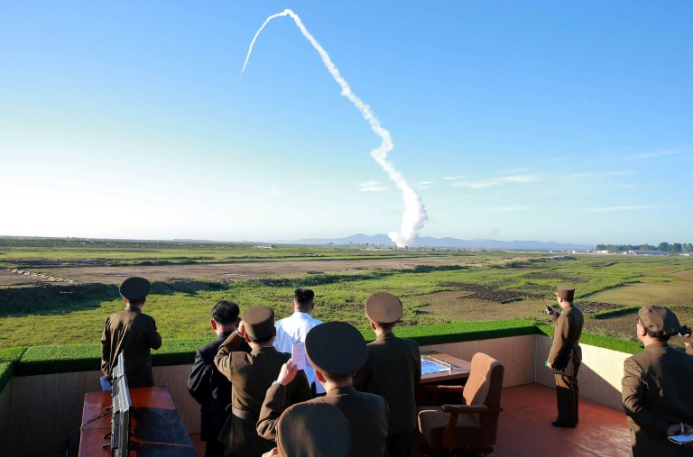 North Korean leader Kim Jong-Un watching the test of a new anti-aircraft guided weapon system organized by the Academy of National Defence Science. (Photo:AFP/KCNA)