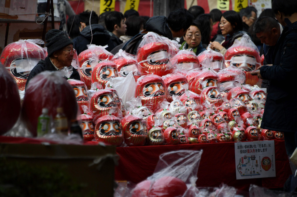 Dharma dolls are seen on display at the Dharma doll market at the Jindaiji temple in Tokyo on March 4, 2017. (Photo: AFP/Toshifumi Kitamura)