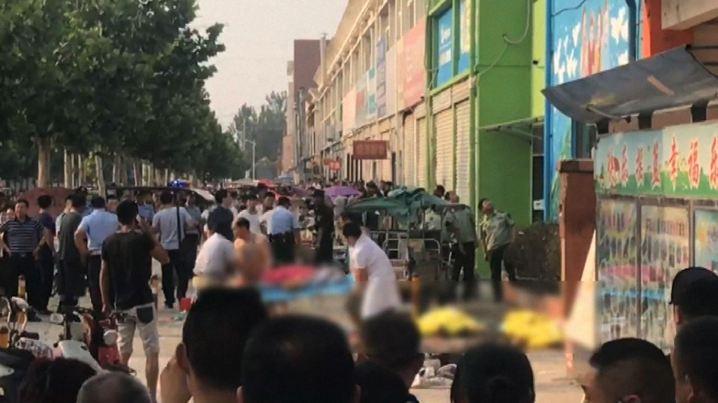This screengrab taken from a broadcast by China's State broadcaster CCTV on June 15, 2017, shows the aftermath of an explosion outside a kindergarten in the eastern Chinese city of Xuzhou.(Photo:AFP/CCTV)