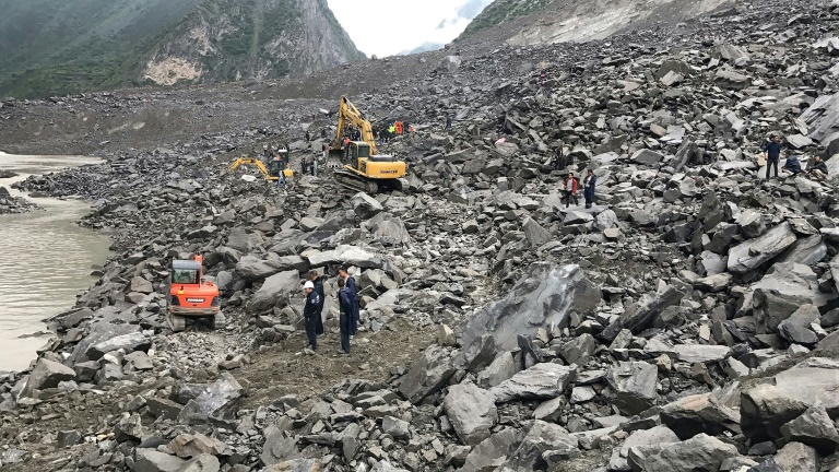 A couple and a baby were rescued and taken to hospital after 46 homes in the Chinese village of Xinmo were swallowed when the side of a mountain collapsed. (Photo:AFP/STR)