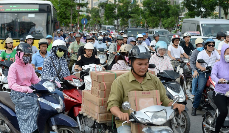 Officials in Vietnam's traffic-clogged capital Hanoi vowed on July 4 to banish motorbikes by 2030 to ease environment and congestions woes. (Photo:AFP/Hoang Dinh Nam)