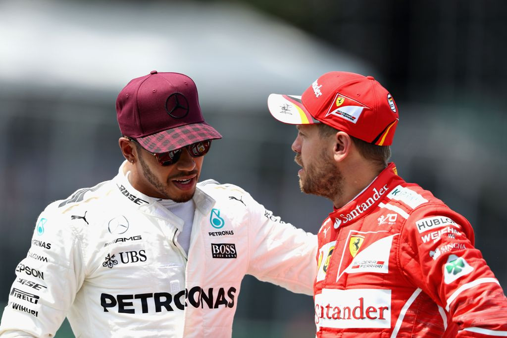 Sebastian Vettel (kanan) dan Lewis Hamilton (Mark Thompson/Getty Images/AFP)