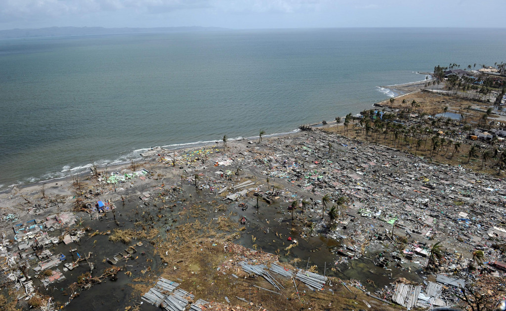 This file photo taken on November 11, 2013 shows flattened houses in the city of Tacloban, Leyte province, in the central Philippines, days after Super Typhoon Haiyan devastated the town on November 8, 2013. (Photo:AFP/Ted Aljibe)