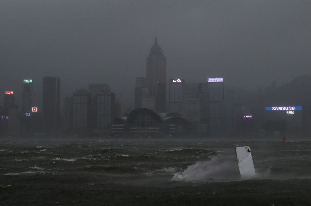 Heavy rains and driving winds lashed Hong Kong on August 23 shutting schools and the stock market and bringing chaos to the city's international airport where hundreds of flights were cancelled. (AFP/Anthony Wallace)