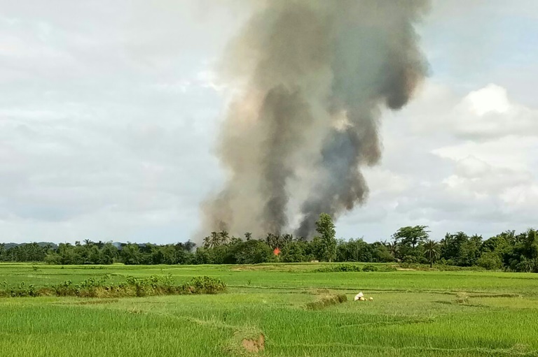 Smoke rises from what is believed to be a burning village near Maungdaw in Myanmar's Rakhine state. (Photo:AFP/STR)