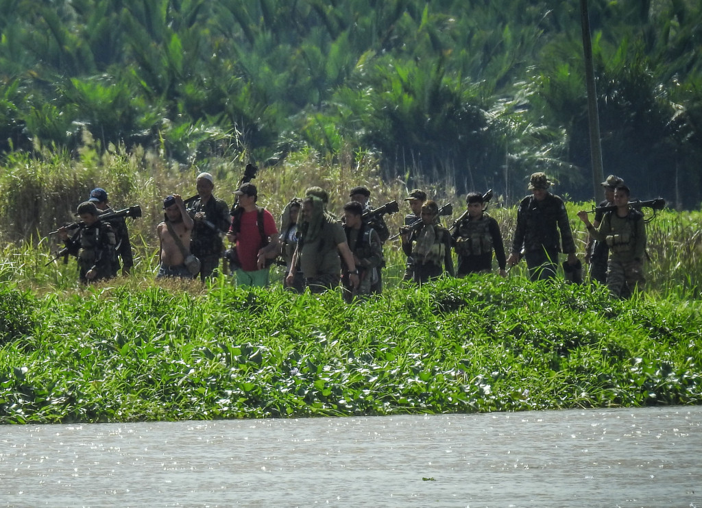 In this photo taken on September 5, 2017 shows Moro Islamic Liberation Front (MILF) rebels from the 118th base command patrolling an area once held by ISIS militants in Datu Salibo town, Maguindanao province, in southern island of Mindanao.  (Photo:AFP/Fe