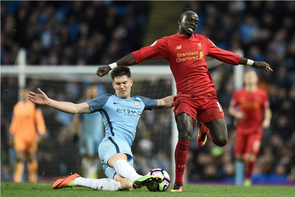 Pertemuan Manchester City kontra Liverpool musim lalu (AFP PHOTO / Oli SCARFF)
