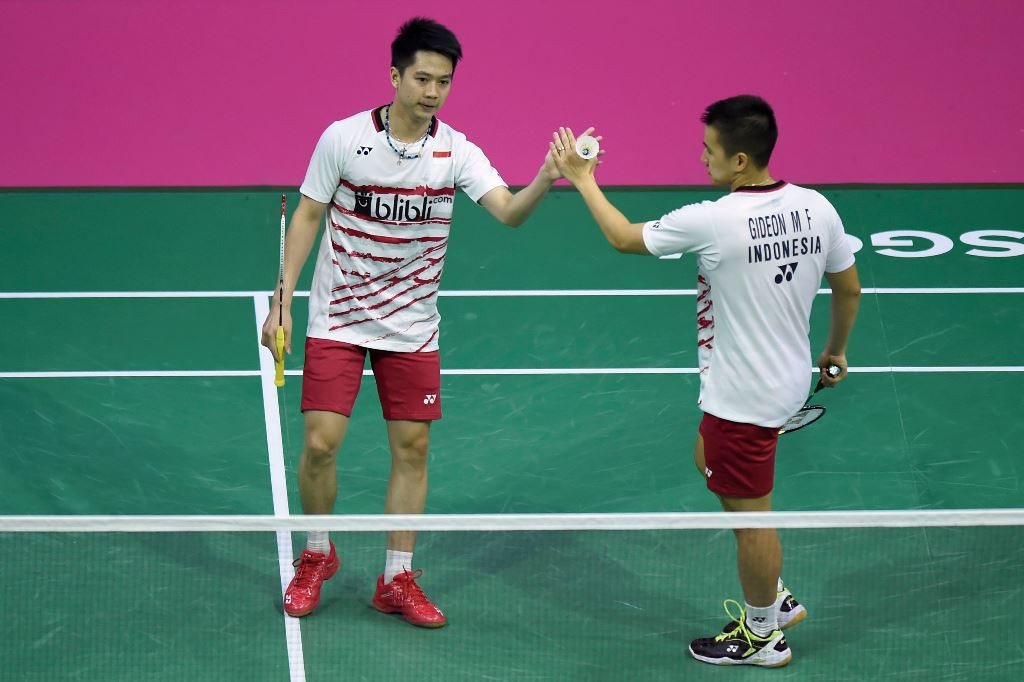 Marcus Gideon/Kevin Sanjaya. (Foto: AFP PHOTO / ANDY BUCHANAN)