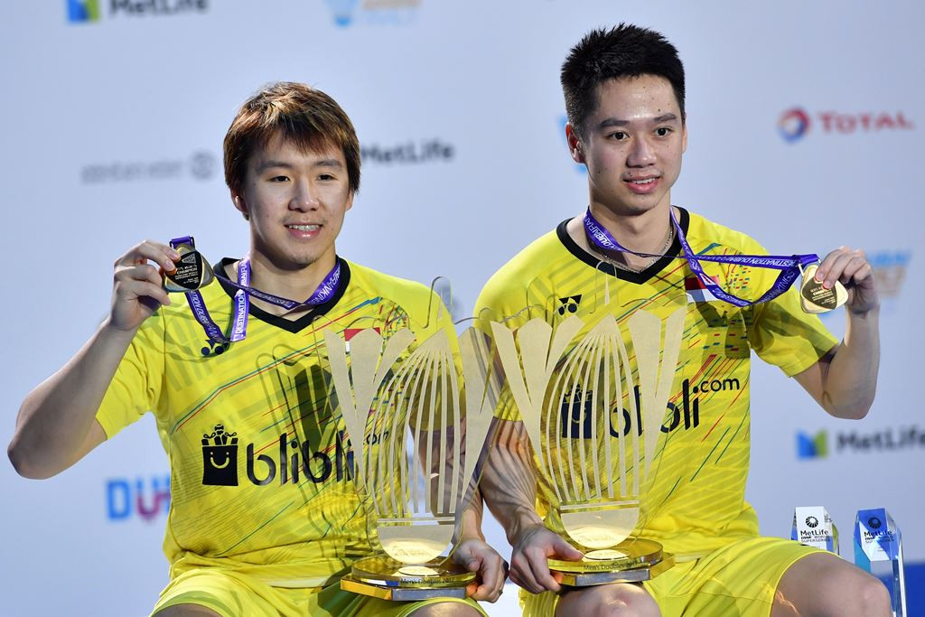 Kevin Sanjaya Sukamuljo (R) dan Marcus Fernaldi Gideon menjuarai Dubai World Super Series Finals 2017. (Foto: AFP/Giuseppe Cacace)