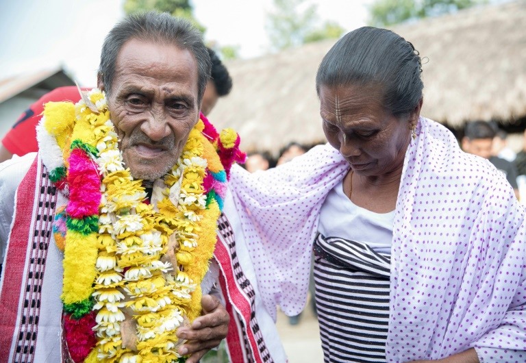 Khomdram Gambhir Singh was welcomed home to remote Manipur 40 years after he left, reunited with family when someone saw a YouTube video of him singing. (Photo:AFP/Deepak Shijagurumayum)