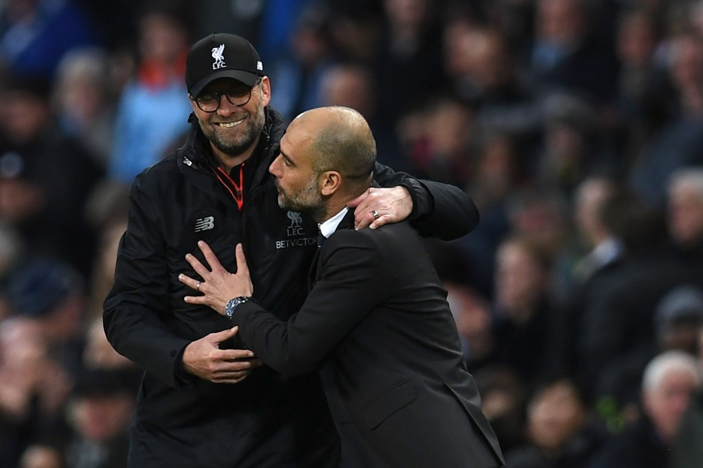 Juergen Klopp (kiri) dan Pep Guardiola (kanan) (Foto: AFP PHOTO / Paul ELLIS)