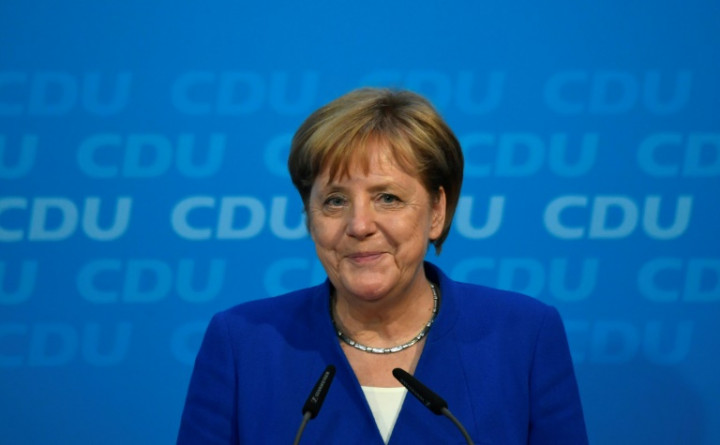 Merkel Dodges Political Bullet with Controversial Migrant Deal