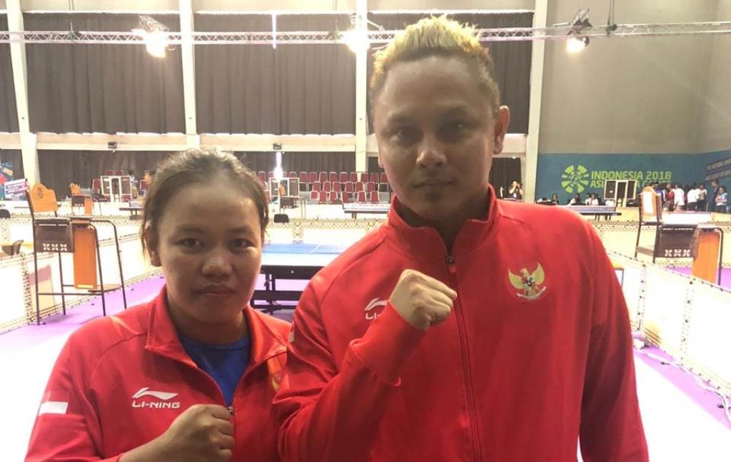 Ganda campuran para tenis meja Indonesia Mohamad Rian Prahasta/Suwarti mengoleksi emas Asian Games 2018 (Foto: medcom.i/M. Rizky Adhestian)