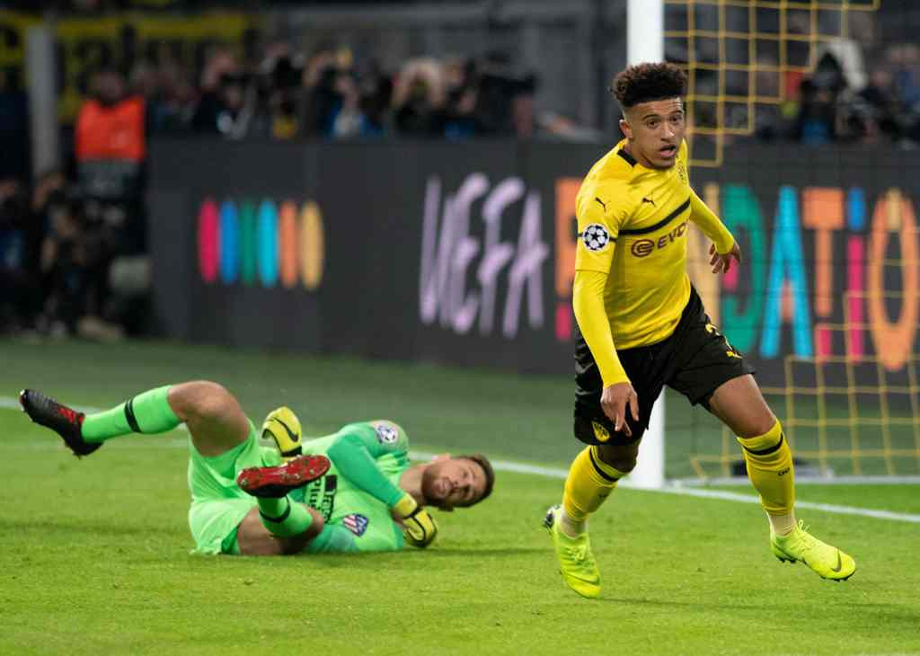 Selebrasi Jadon Sancho saat membobol gawang Atletico Madrid (Foto: AFP/BERND THISSEN)