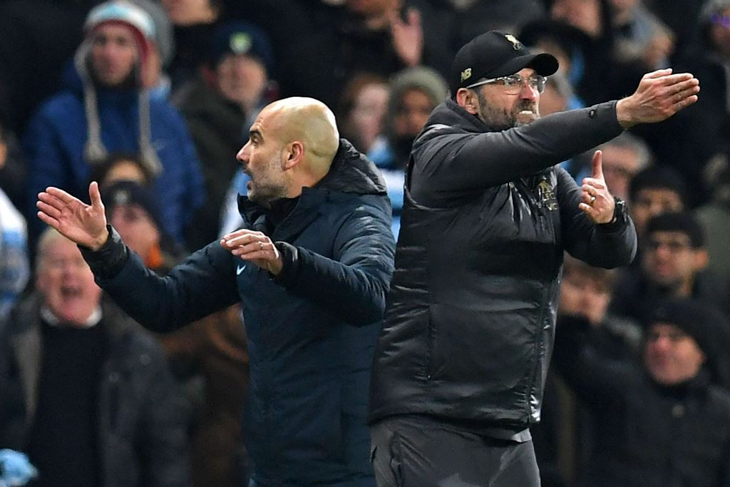 Pelatih Manchester City, Pep Guardiola (kiri) dan pelatih Liverpool, Jurgen Klopp (AFP/Paul Ellis)