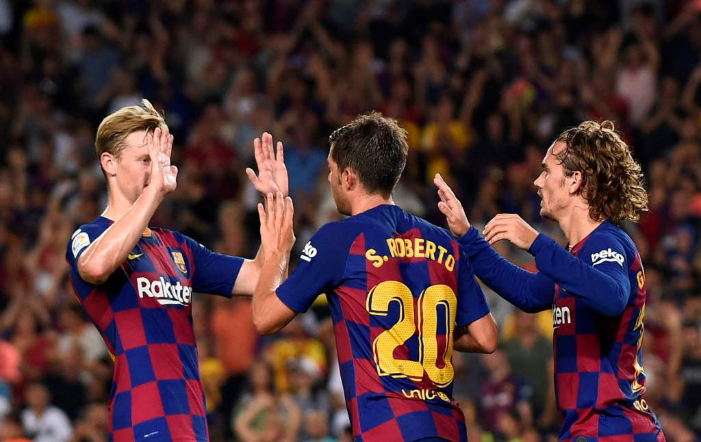 Selebrasi para pemain Barcelona usai meraih kemenangan atas Real Betis (Foto: AFP/Josep Lago)