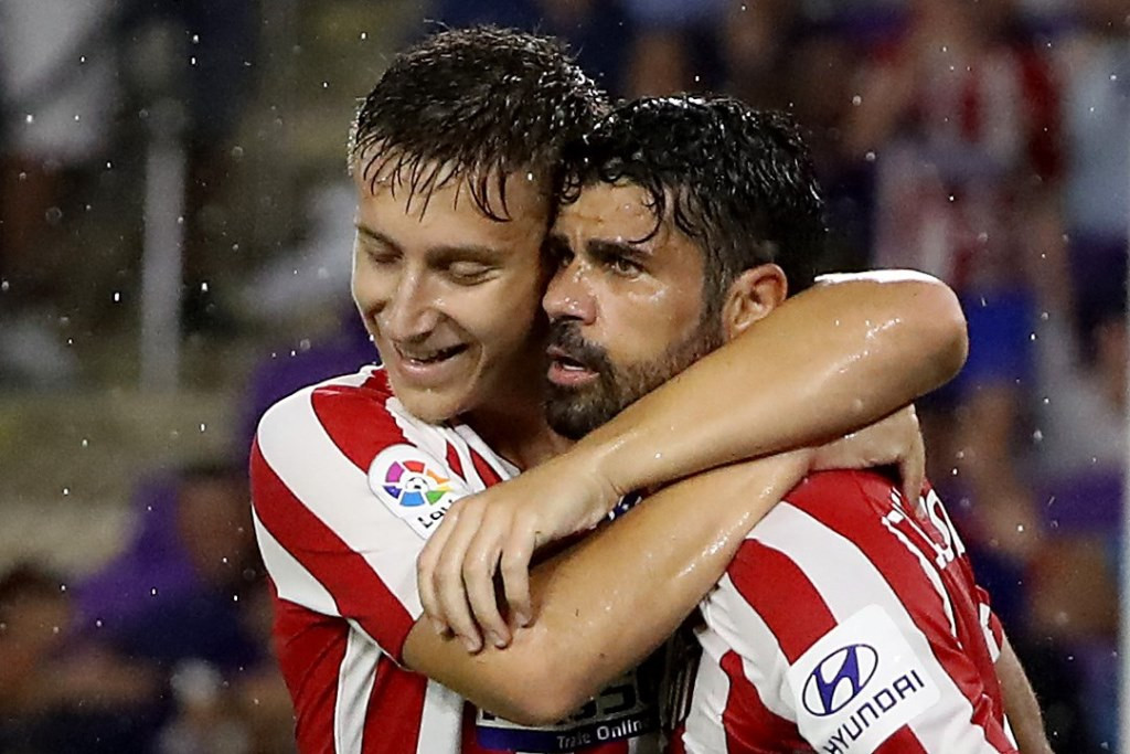  Ivan Saponjic dan Diego Costa rayakan gol Atletico Madrid. (Sam Greenwood/Getty Images/AFP)