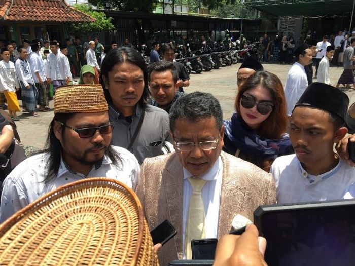 Komentar Hotman Paris soal Putusan KPPU kepada Grab Indonesia