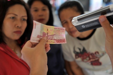 Ilustrasi--Sosialisasi uang rupiah (ANTARA FOTO/Nyoman Budhiana)