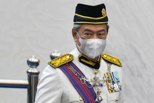 PM Malaysia Muhyiddin Yassin memakai masker. Foto: AFP.