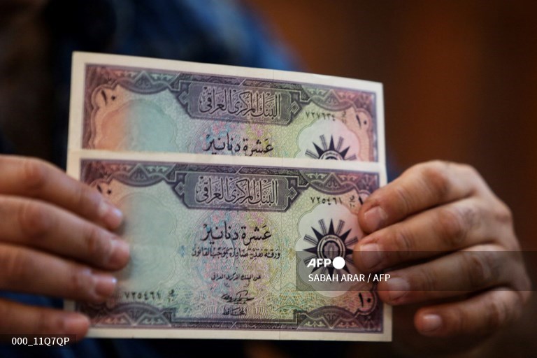 Dinar irak. Foto : AFP/Sabah Arar. 