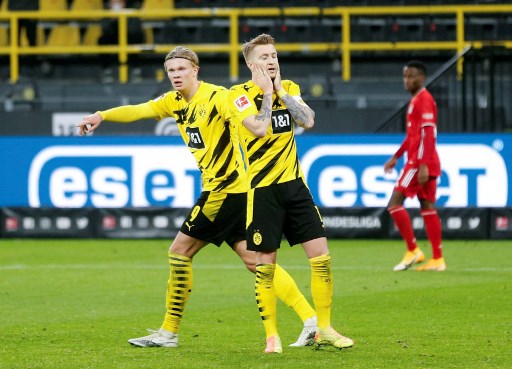 Marco Reus (kanan) dan Erling Haaland (kiri).LEON KUEGELER / POOL / AFP)