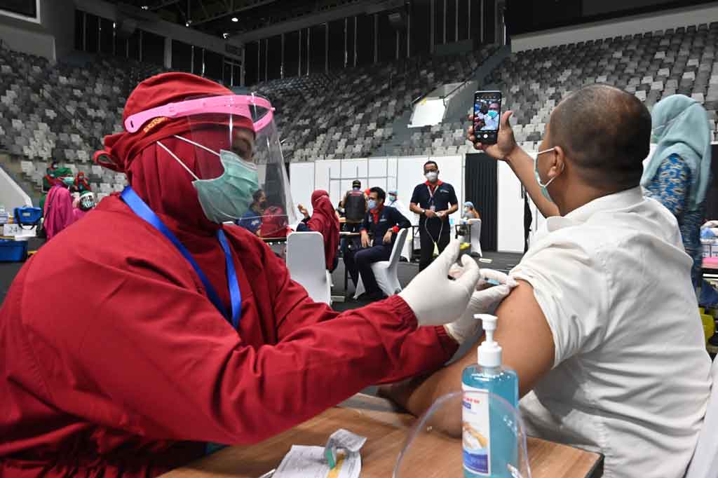 Ilustrasi vaksinasi massal - - Foto: dok AFP