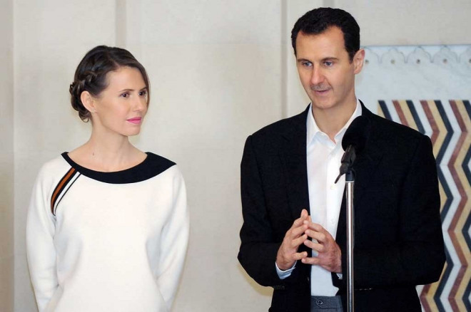 Presiden Suriah Bashar al-Assad dan istrinya, Alma al-Assad. (AFP/Syrian Presidency Facebook/SANA)