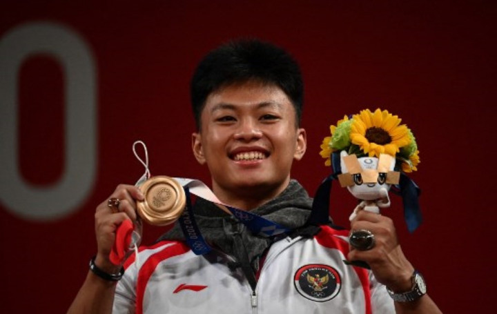 Profil Rahmat Erwin Abdullah, Lifter Masa Depan Indonesia yang Bersinar di Olimpiade 2020