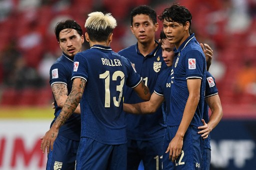 Selebrasi gol para pemain Thailand. (Roslan RAHMAN / AFP)