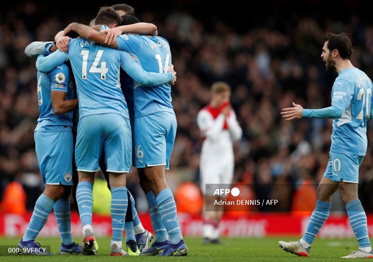 Pemain Manchester City merayakan kemenangan aras Arsenal (AFP/Adrian Dennis)