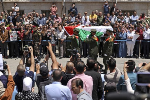 Populer Internasional: Ribuan Orang Iringi Peti Mati Jurnalis Palestina hingga Kematian Covid Pertama Korut