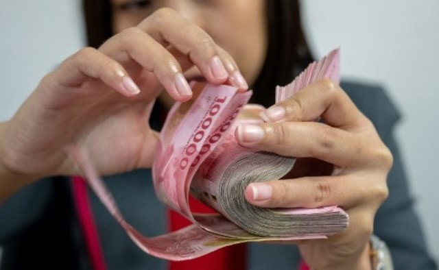 Ilustrasi Rupiah. Foto: AFP/Bay Ismoyo